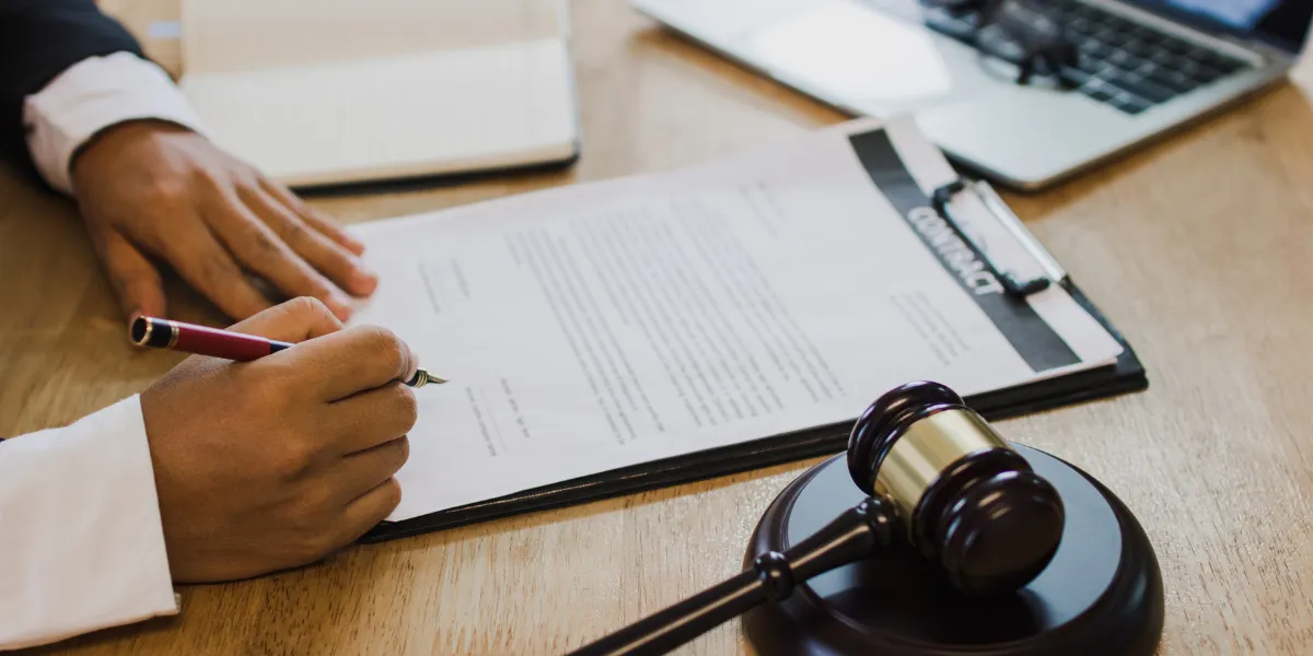 Notary verifying a signer’s identity on a document; notarization alone does not make it legally binding.
